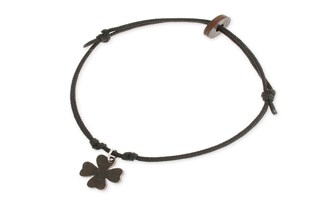 Bransoletka z czarnego sznurka jubilerskiego, którą opisujesz, jest kwintesencją minimalistycznego stylu z subtelnym etnicznym akcentem