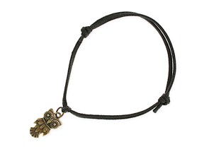 Bransoletka wykonana z czarnego sznurka woskowanego z zawieszką w kształcie sowy koloru złotego