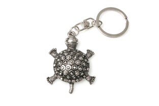 Elegancki breloczek w kształcie żółwia, wykonany z metalu nieszlachetnego w kolorze starego srebra