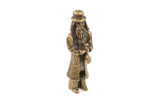 Stojąca figurka Żyda z sakiewką, wykonana z metalu nieszlachetnego w kolorze starego złota
